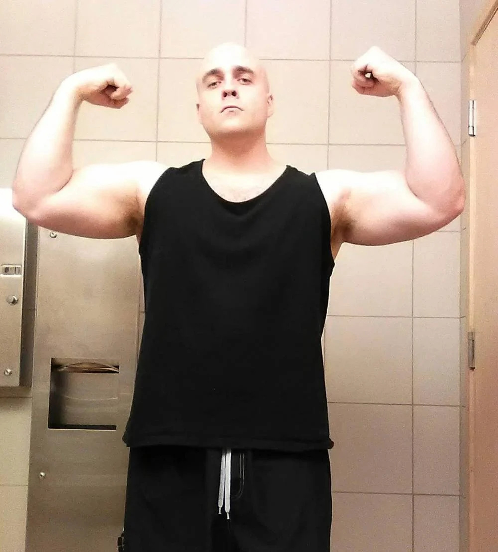 Jeremy Skibicki in a black tank top, flexing, in a photo widely published after his arrest