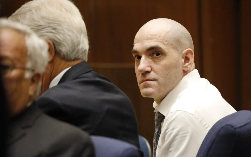 Michael Gargiulo, head shaved and in a white shirt, in a Los Angeles courtroom