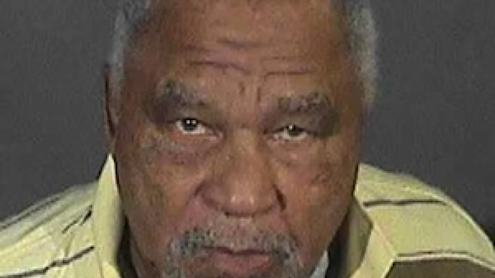 Police photograph of Samuel Little in a striped shirt