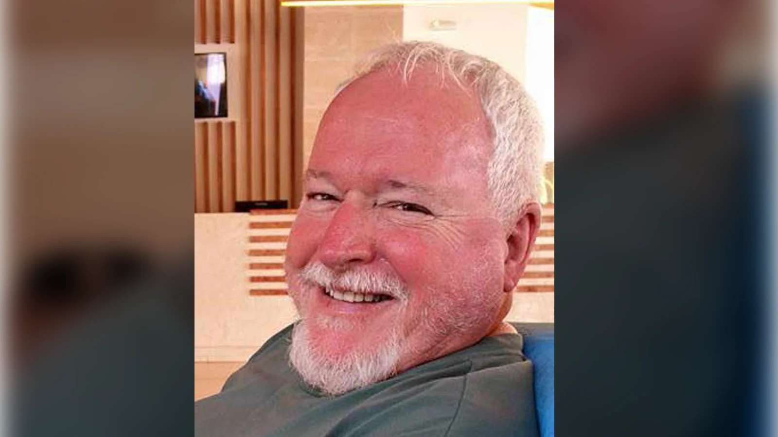 Personal snapshot of Bruce McArthur smiling, seated indoors, published by news outlets after his arrest