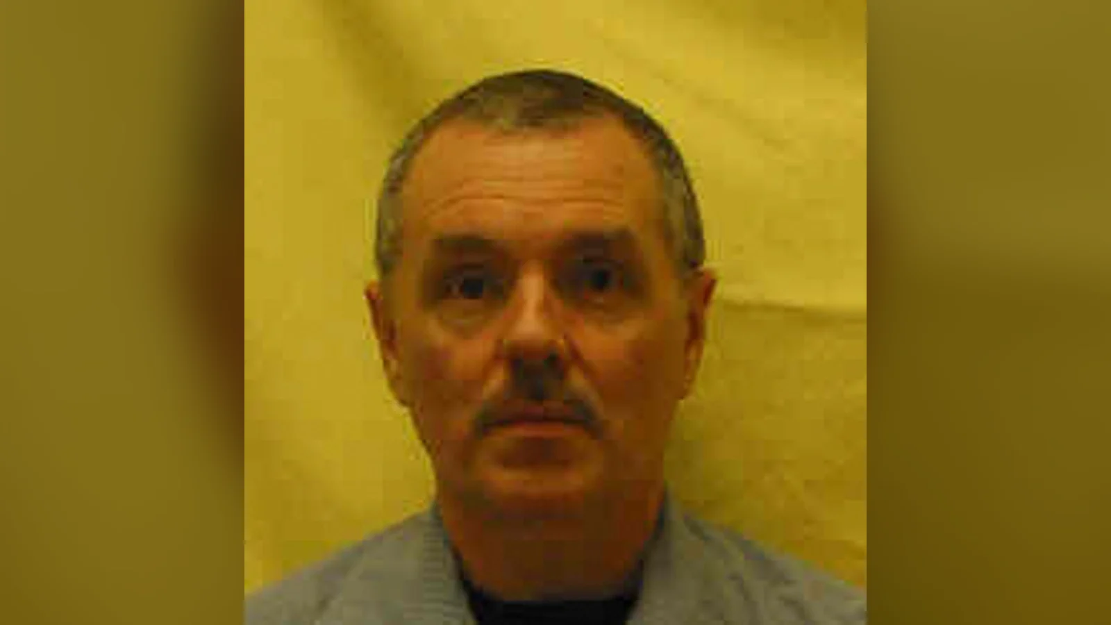 Donald Harvey in a later Ohio prison identification photo, gray-haired, in a blue prison shirt