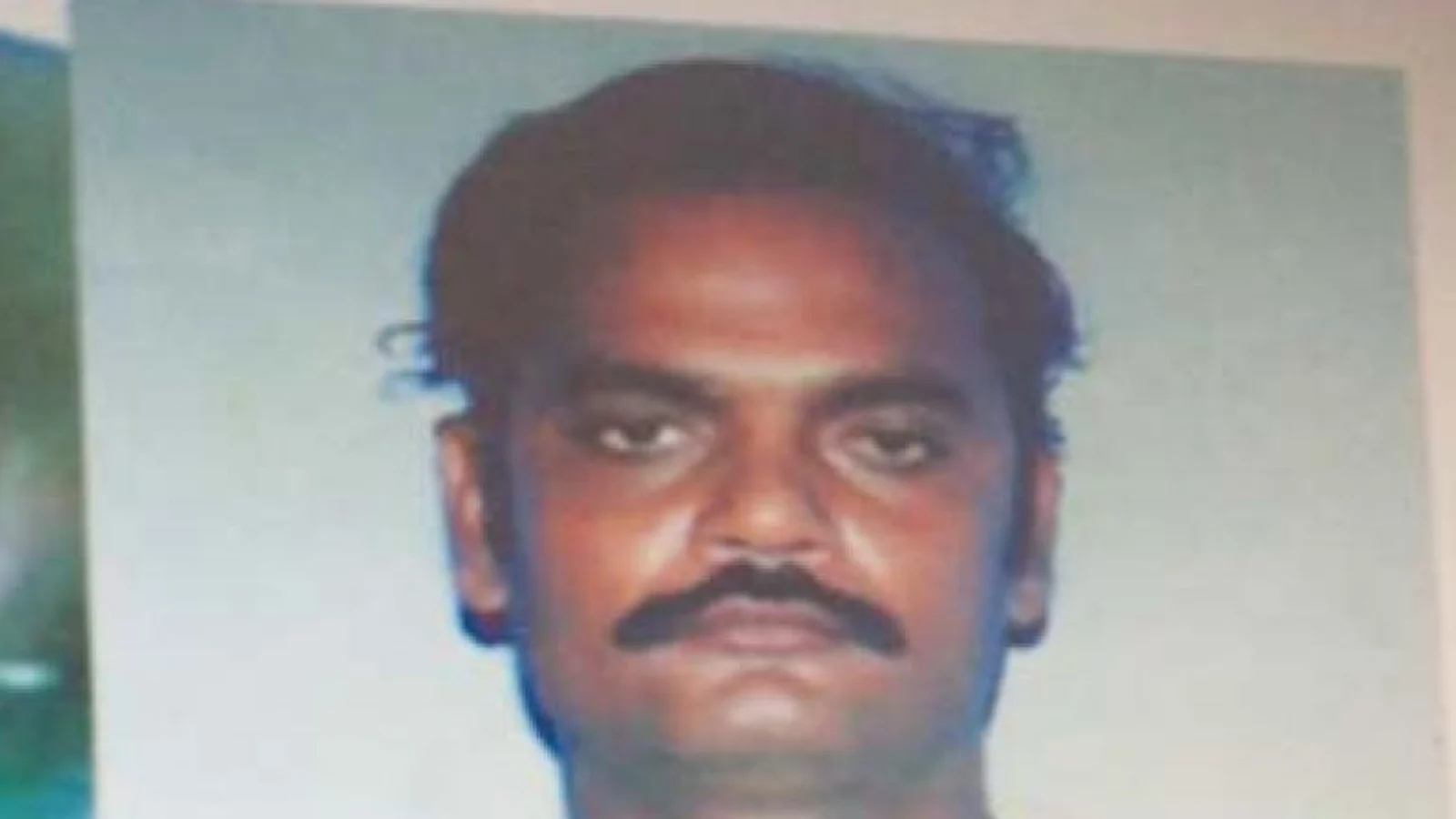 Police photograph of M. Jaishankar, with a mustache, against a pale background