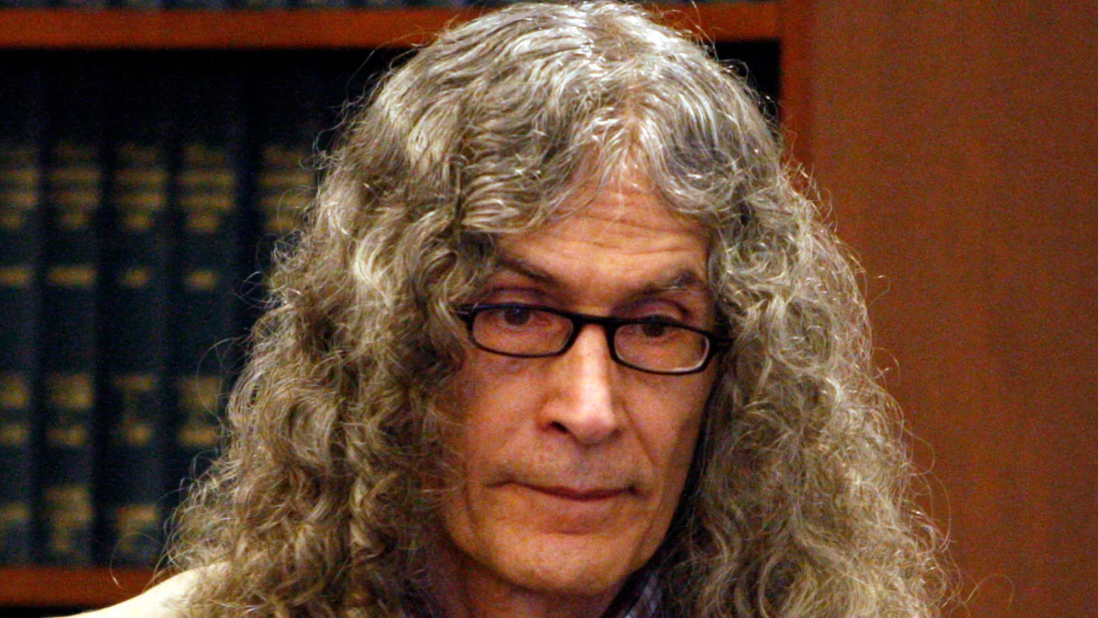 Rodney Alcala, with long gray curly hair and glasses, in an Orange County courtroom