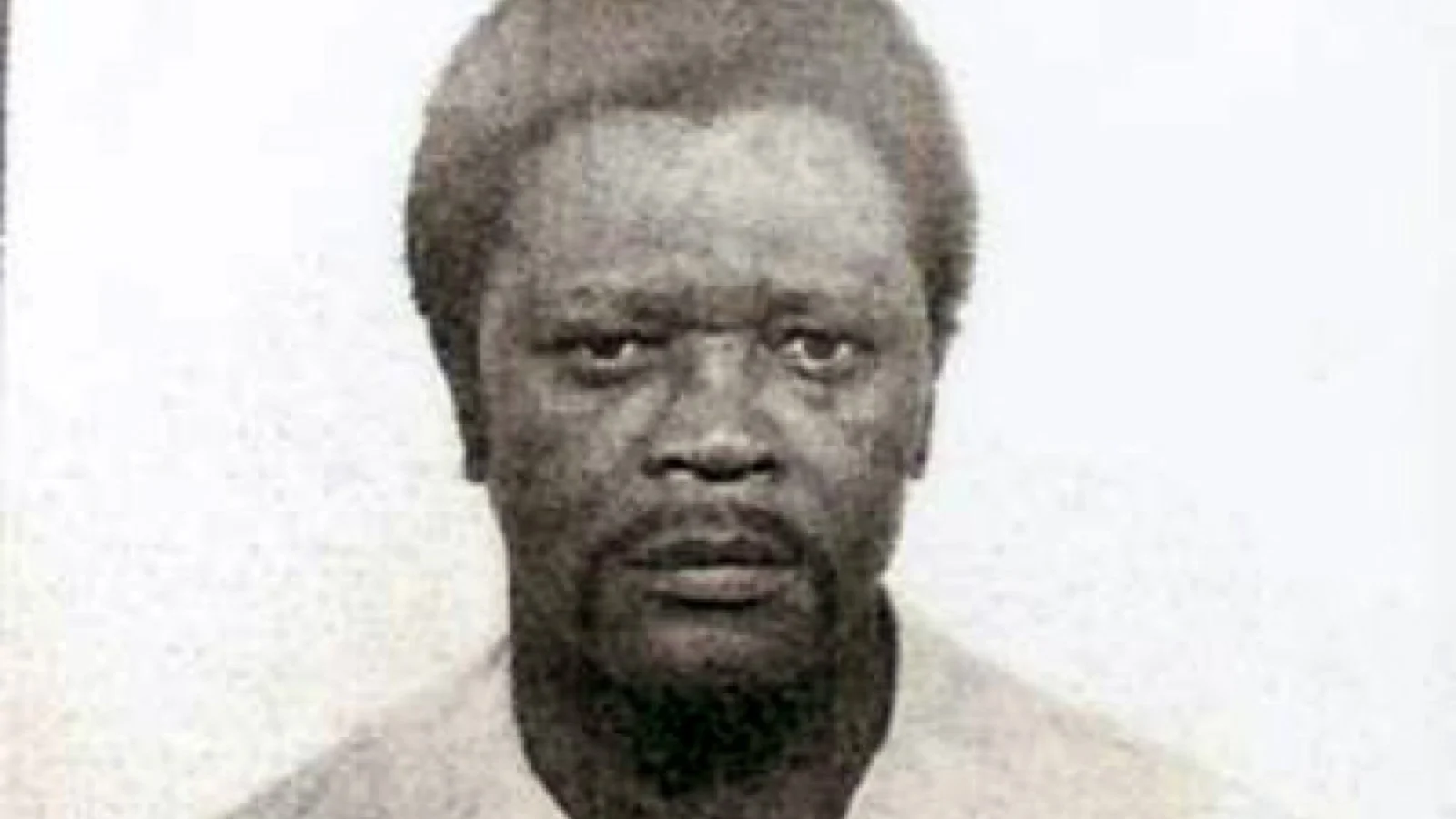 John Floyd Thomas Jr. in a 1982 California prison booking photograph