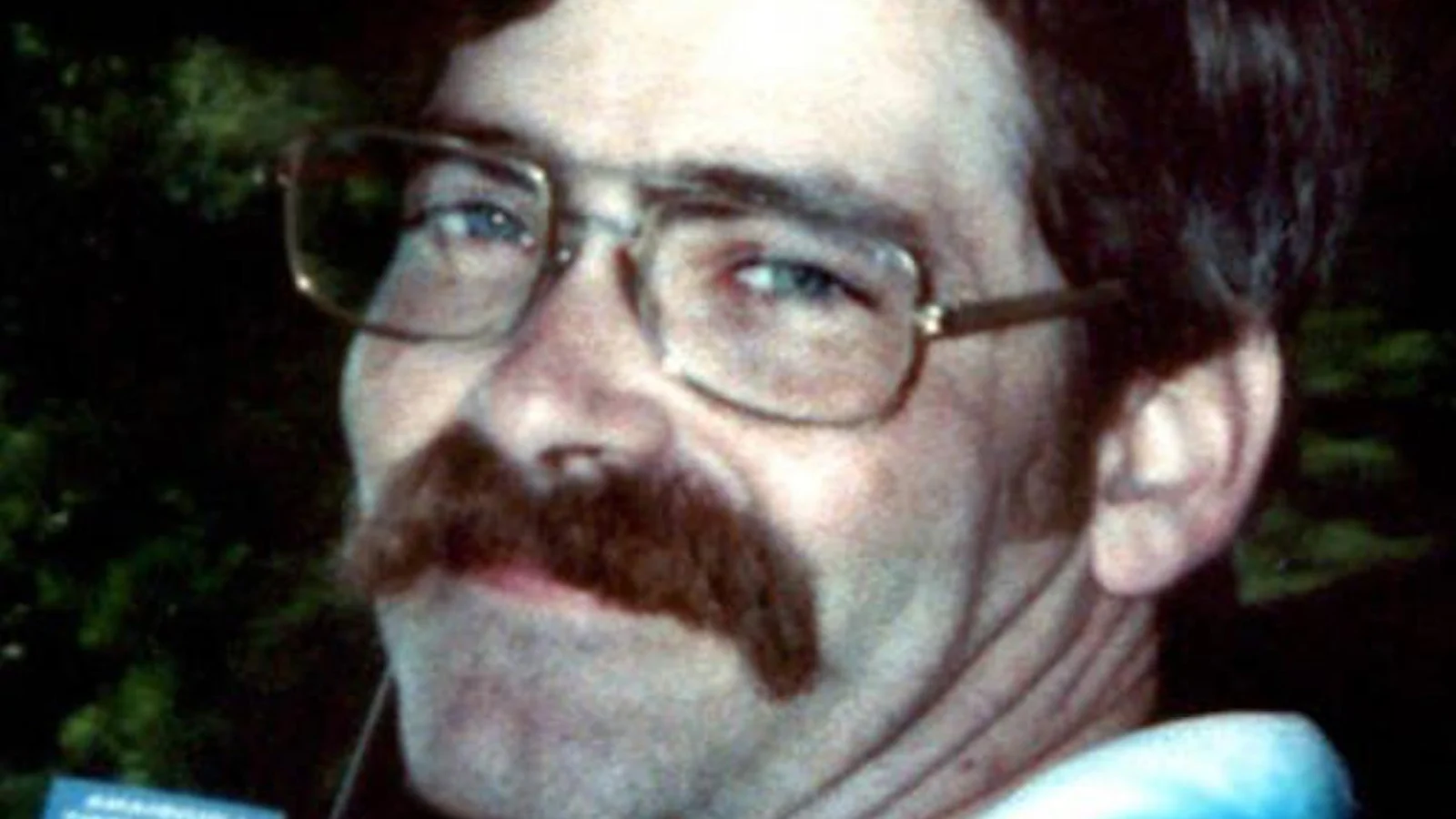 Sean Vincent Gillis, wearing glasses and a mustache, in a snapshot taken before his arrest