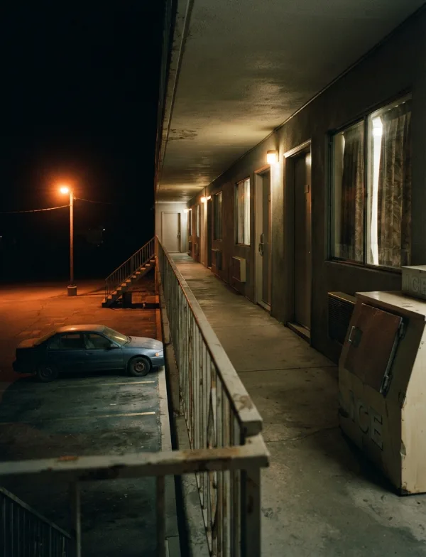 Illustration: roadside motel second-floor walkway at night